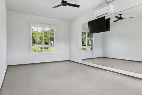 a view of a swimming pool with a patio and a yard