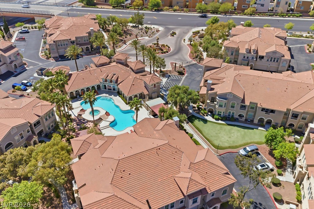 10550 West Alexander Road, Unit 2133 Las Vegas, NV 89129 - Photo 2 of 42 The pool area with the rock waterfall feature.