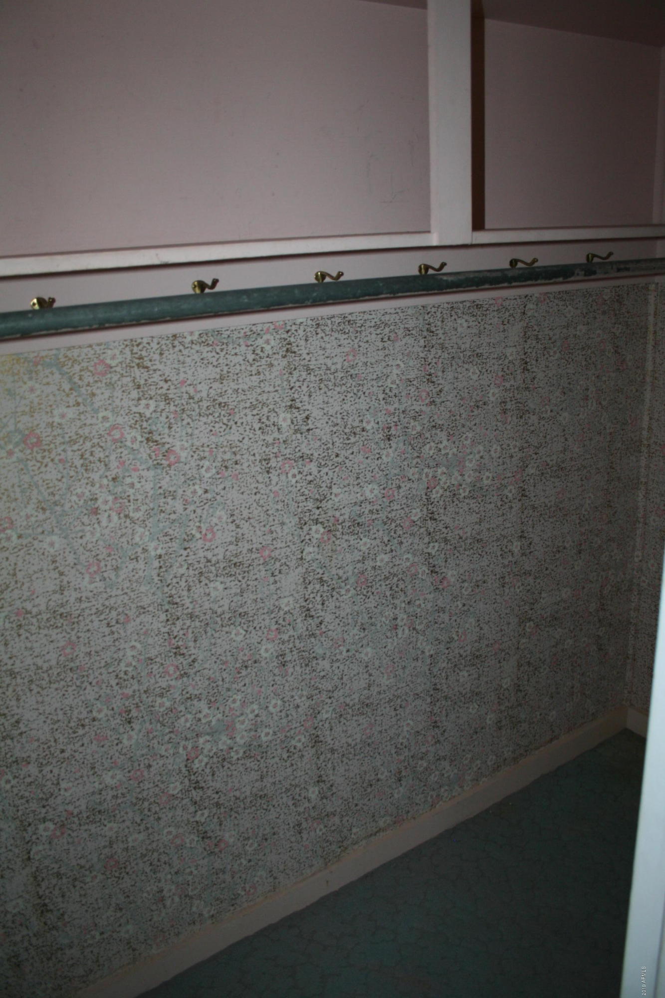 200 E Vista Bisbee, AZ 85603 - Photo 30 of 96 a close up view of racks on the wall