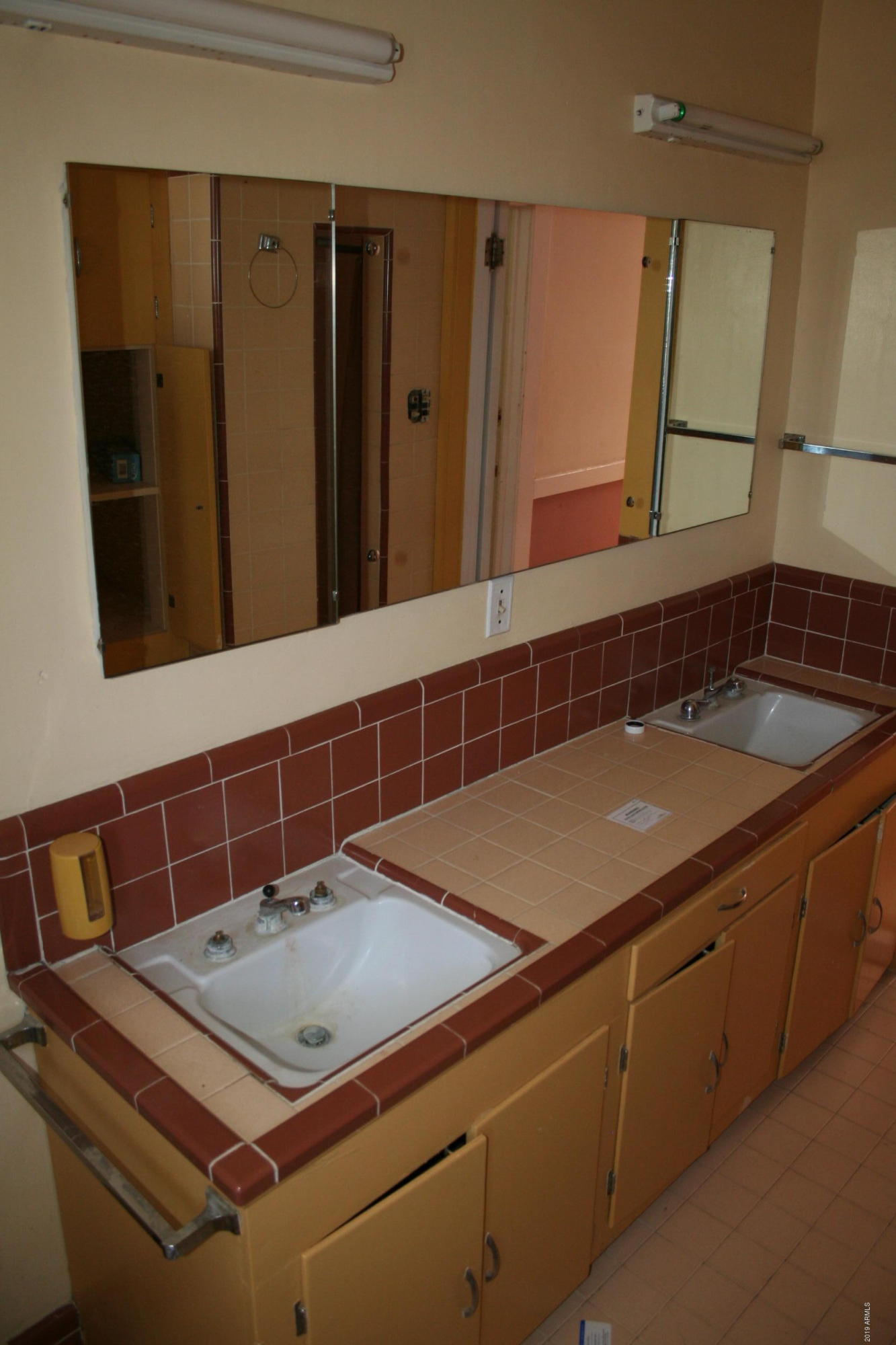 200 E Vista Bisbee, AZ 85603 - Photo 38 of 96 a bathroom with a sink and a mirror