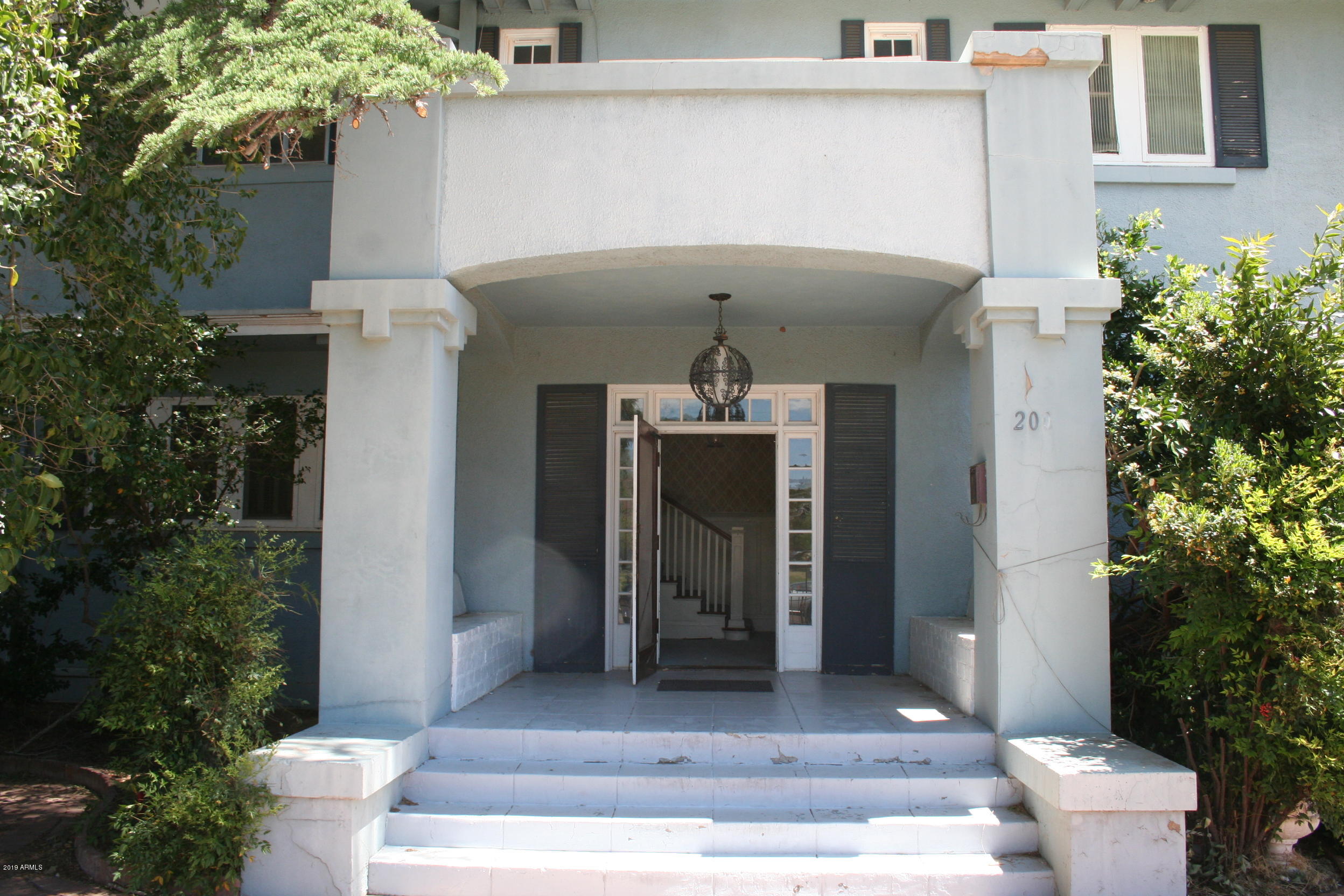 200 E Vista Bisbee, AZ 85603 - Photo 4 of 96 a front view of a house with a toilet