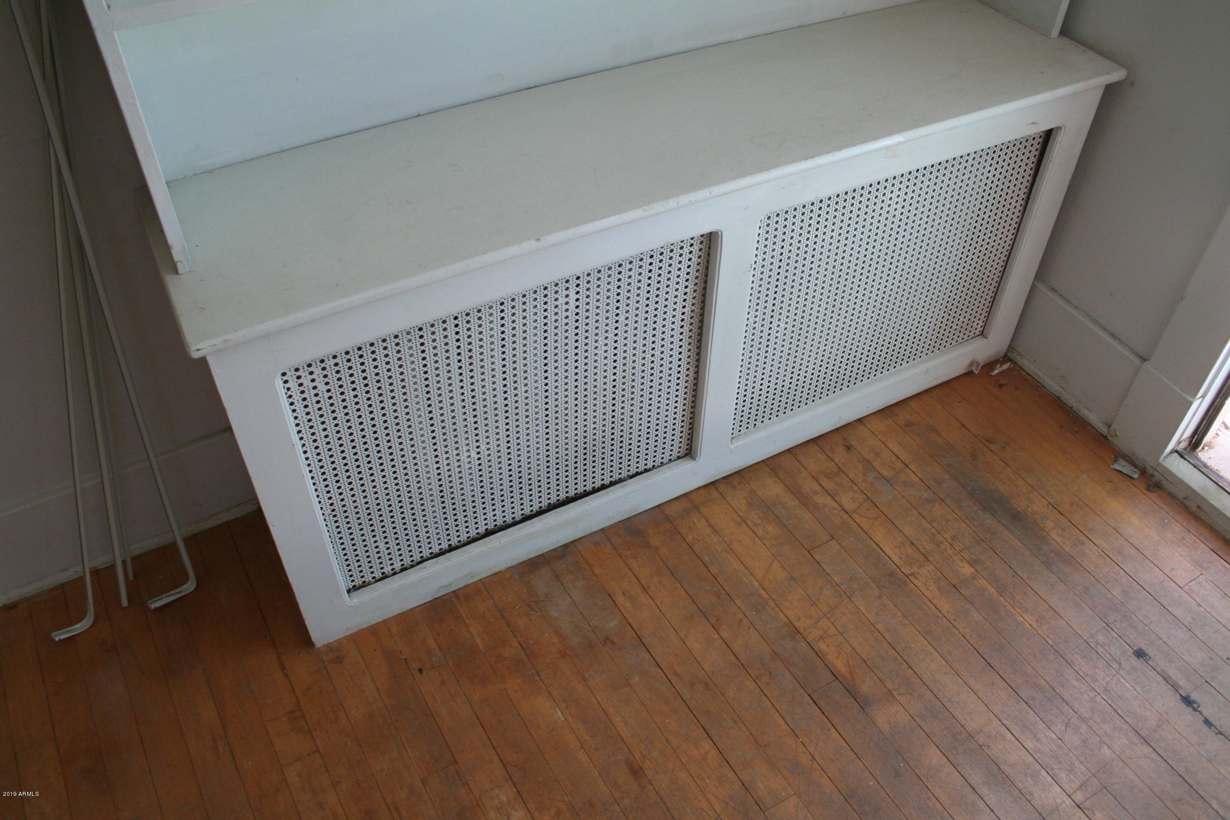 200 E Vista Bisbee, AZ 85603 - Photo 42 of 96 a view of a hallway with wooden floor