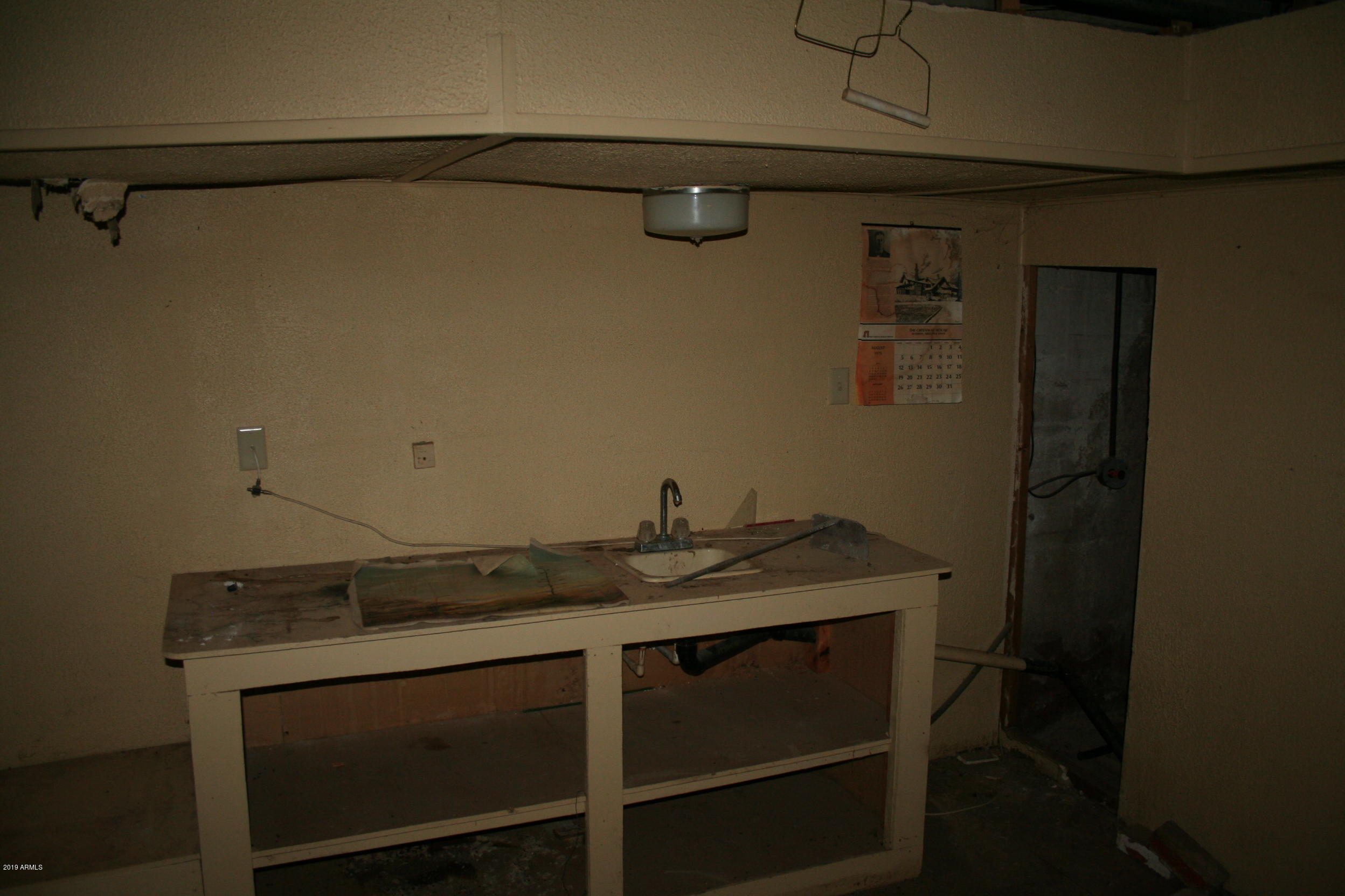 200 E Vista Bisbee, AZ 85603 - Photo 55 of 96 a view of a sink and cabinets