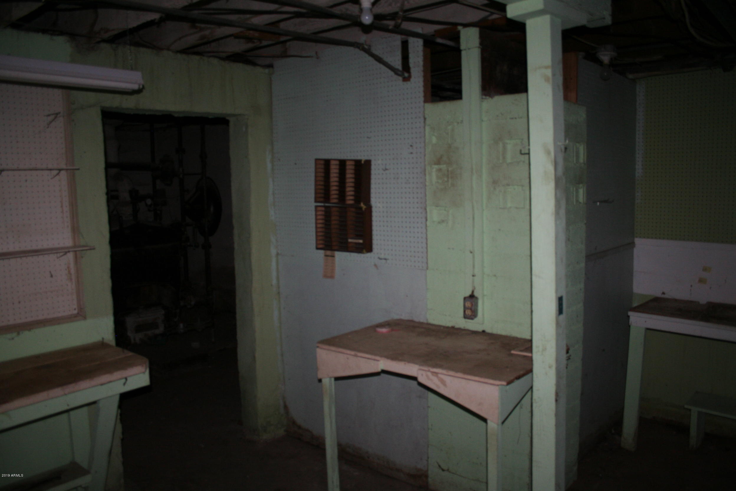 200 E Vista Bisbee, AZ 85603 - Photo 58 of 96 a bathroom with a sink and a mirror
