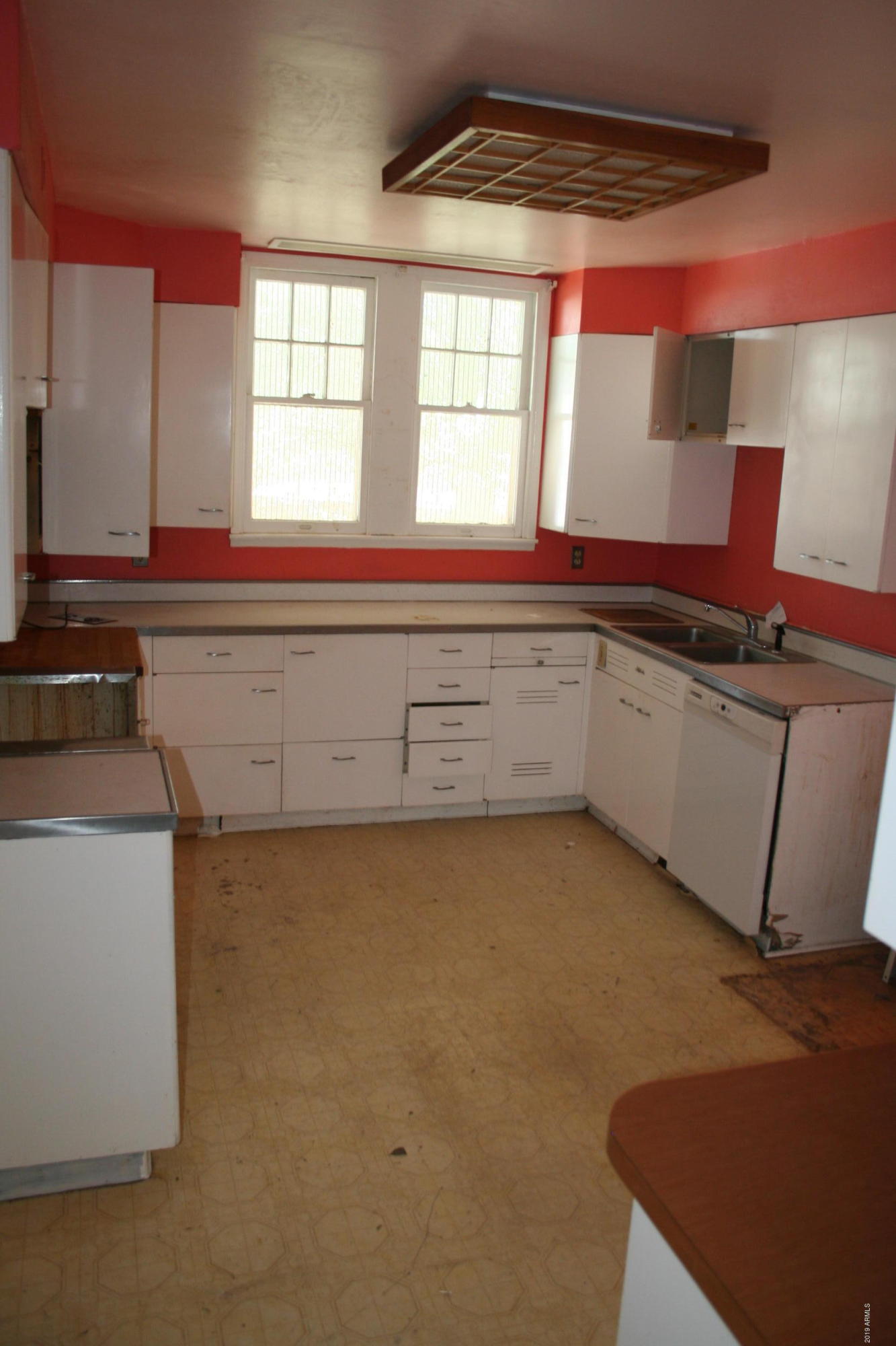 200 E Vista Bisbee, AZ 85603 - Photo 8 of 96 a kitchen with a sink cabinets and a large window