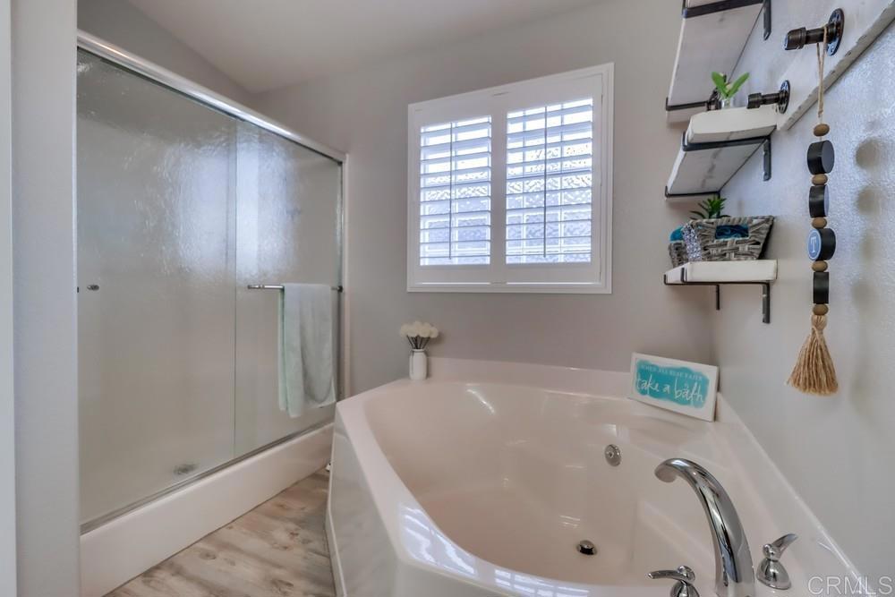 2536 Begonia Way Alpine, CA 91901 - Photo 32 of 58 a bathroom with a tub and shower