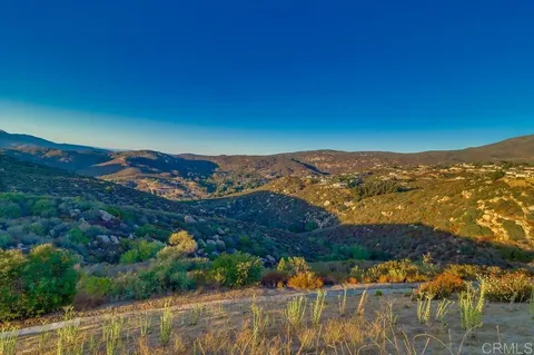 a view of a backyard with sitting area and furniture