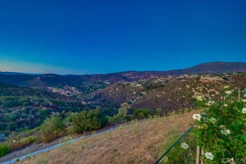 a view of a pathway both side of house