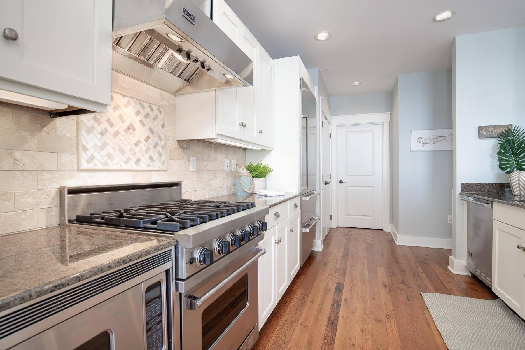 37 Compass Point, Unit 425 Watersound, FL 32461 - Photo 4 of 17 a kitchen with stainless steel appliances granite countertop a stove and a refrigerator