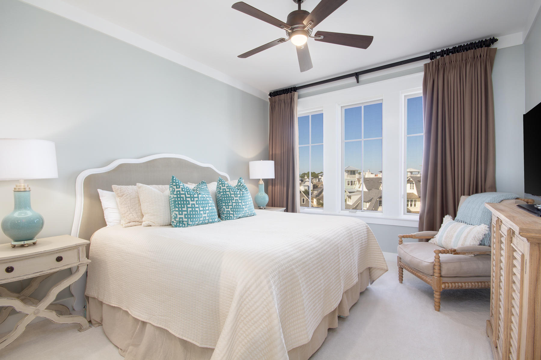 37 Compass Point, Unit 425 Watersound, FL 32461 - Photo 8 of 17 a bedroom with a bed and a chandelier