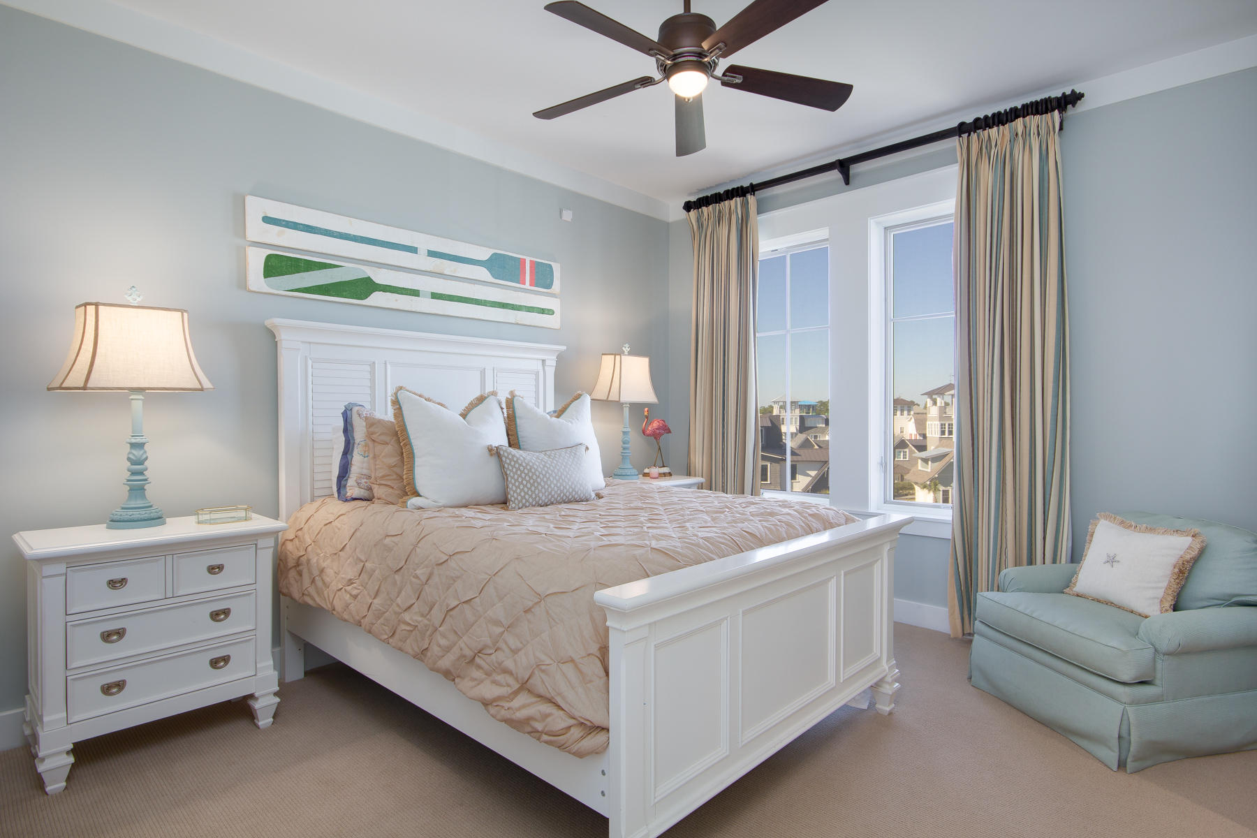 37 Compass Point, Unit 425 Watersound, FL 32461 - Photo 9 of 17 a bedroom with a bed and a chandelier