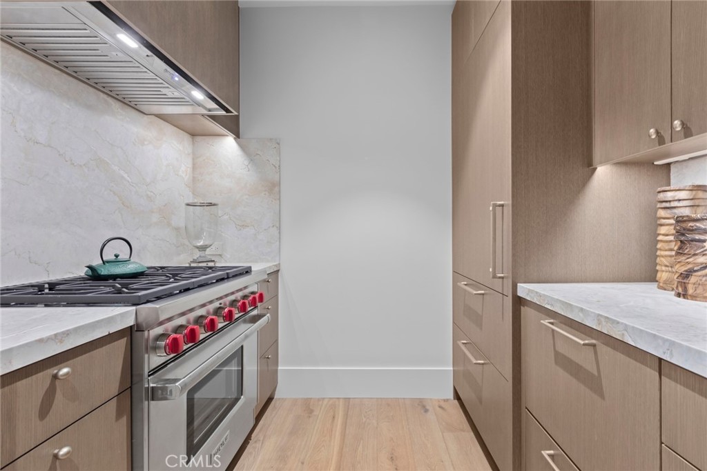 1 Beach View Avenue Dana Point, CA 92629 - Photo 14 of 42 a kitchen with a stove and a wooden floor