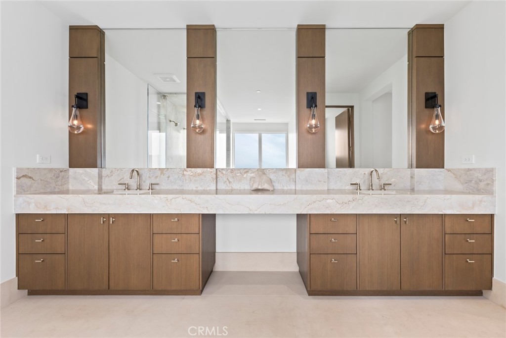 1 Beach View Avenue Dana Point, CA 92629 - Photo 22 of 42 a bathroom with a sink double vanity and a mirror