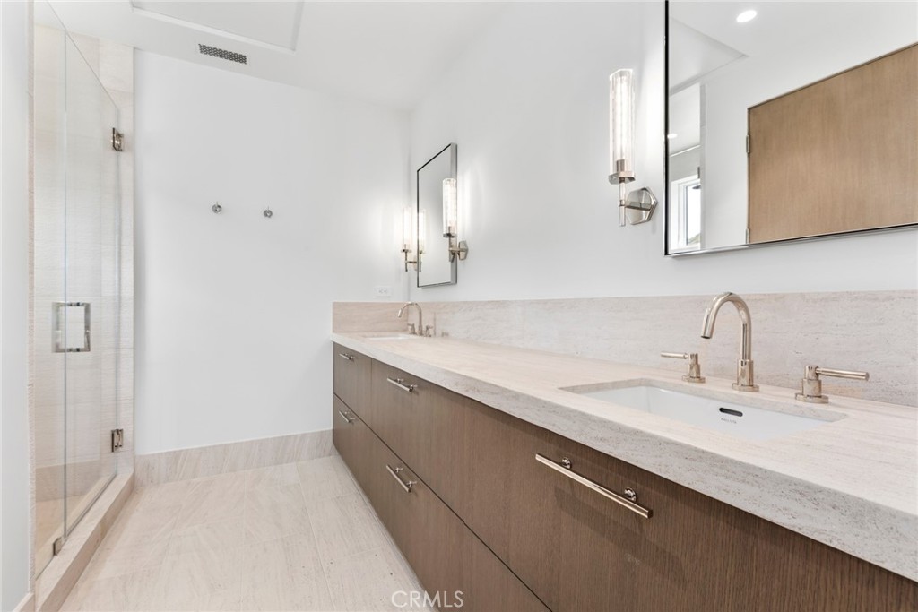 1 Beach View Avenue Dana Point, CA 92629 - Photo 26 of 42 a bathroom with a double vanity sink and mirror