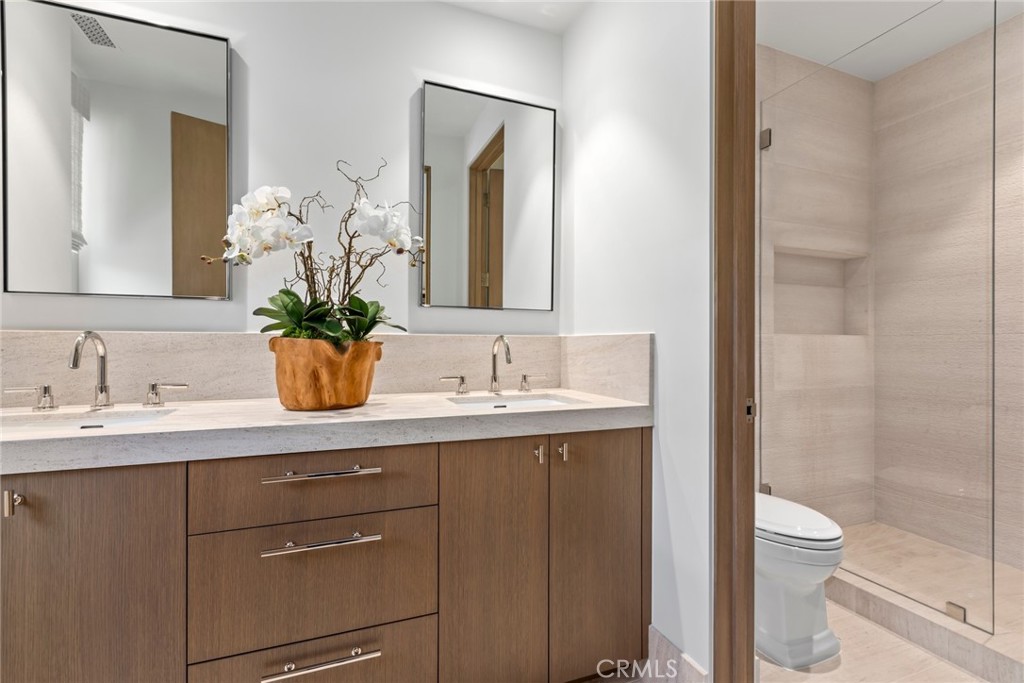 1 Beach View Avenue Dana Point, CA 92629 - Photo 30 of 42 a bathroom with a granite countertop sink mirror and toilet