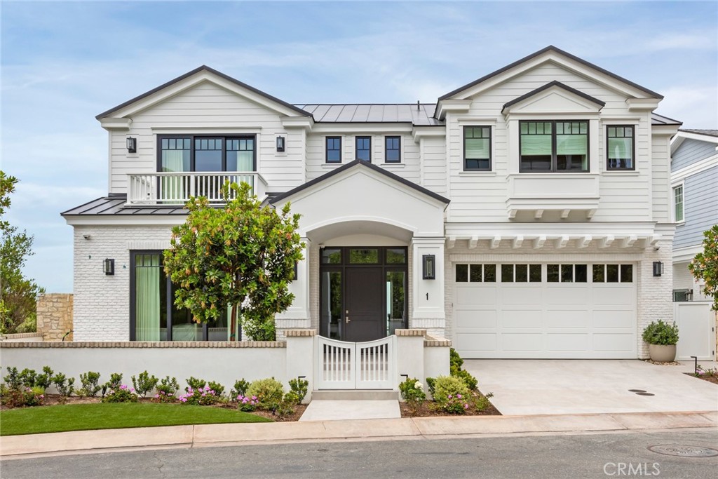 1 Beach View Avenue Dana Point, CA 92629 - Photo 34 of 42 a front view of a house with a yard and garage