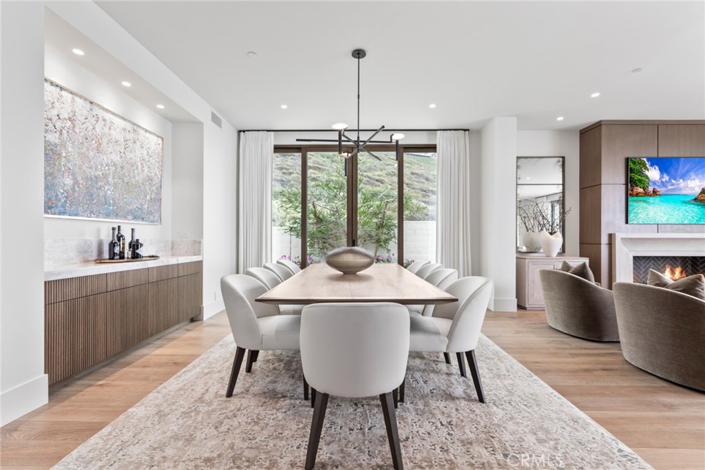 1 Beach View Avenue Dana Point, CA 92629 - Photo 6 of 42 a dining room with furniture a chandelier and wooden floor