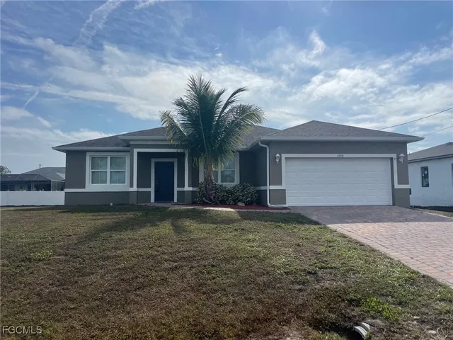 front view of a house with a yard