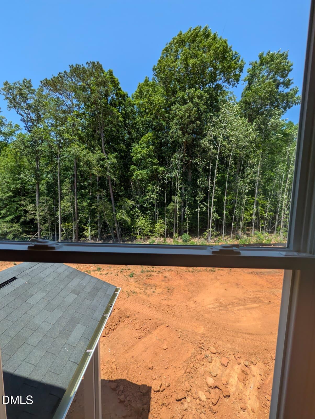 308 Karlov Road Garner, NC 27529 - Photo 39 of 55 a view of a swimming pool and trees in the background