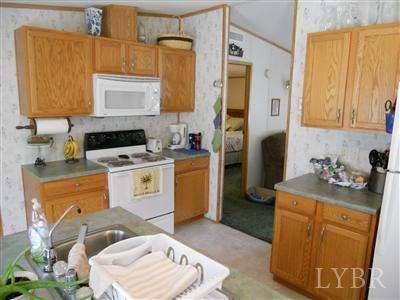 337 Phoebe Pond Road Concord, VA 24538 - Photo 6 of 19 a kitchen with a sink stove and refrigerator