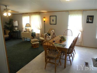 337 Phoebe Pond Road Concord, VA 24538 - Photo 9 of 19 a dining room with furniture and wooden floor