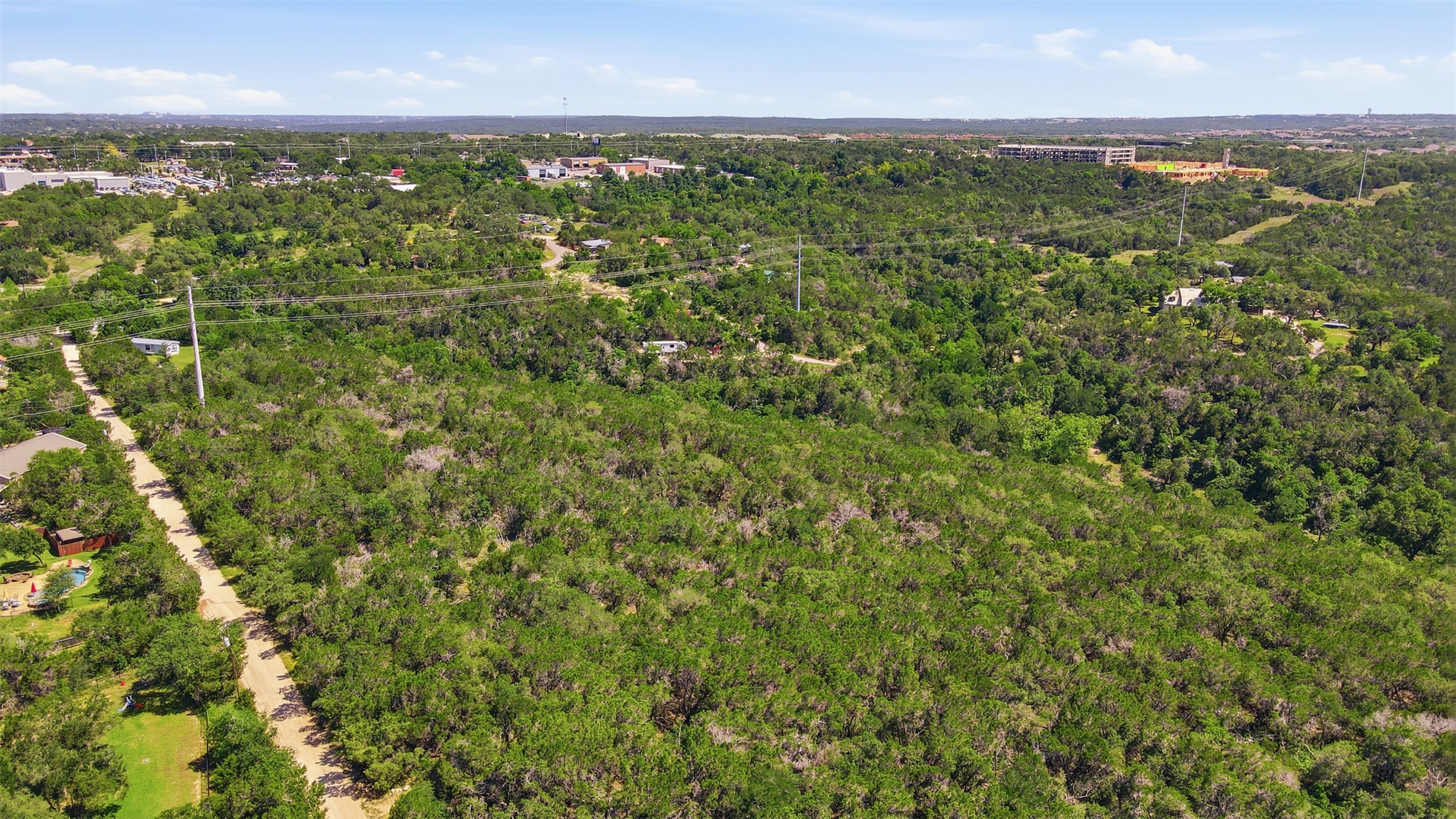 0 North Ranch Road 620 Road Austin, TX 78726 - Photo 5 of 20 an aerial view of residential houses with outdoor space and trees