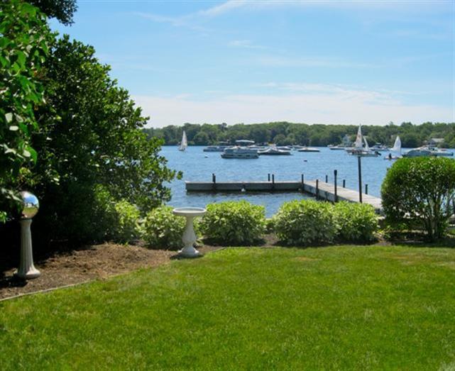 188 Annable Point Road Centerville, MA 02632 - Photo 1 of 22 a view of a garden with a building in the background