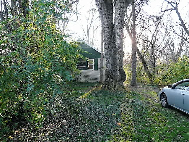 28459 Valley Road Ingleside, IL 60041 - Photo 2 of 11 a view of a backyard with large trees