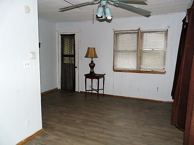 28459 Valley Road Ingleside, IL 60041 - Photo 5 of 11 a view of an empty room with wooden floor and a window