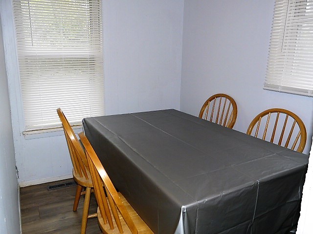 28459 Valley Road Ingleside, IL 60041 - Photo 8 of 11 a view of a dining room with furniture and wooden floor