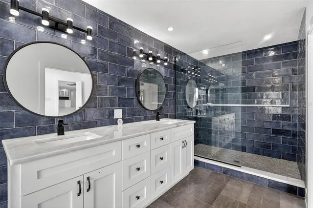 a view of a swimming pool with a patio and a lake view