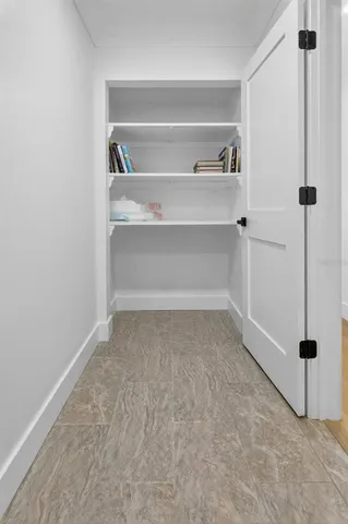 a view of balcony with wooden floor and outdoor seating