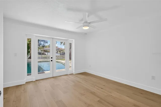 a kitchen with granite countertop stainless steel appliances a stove sink and microwave