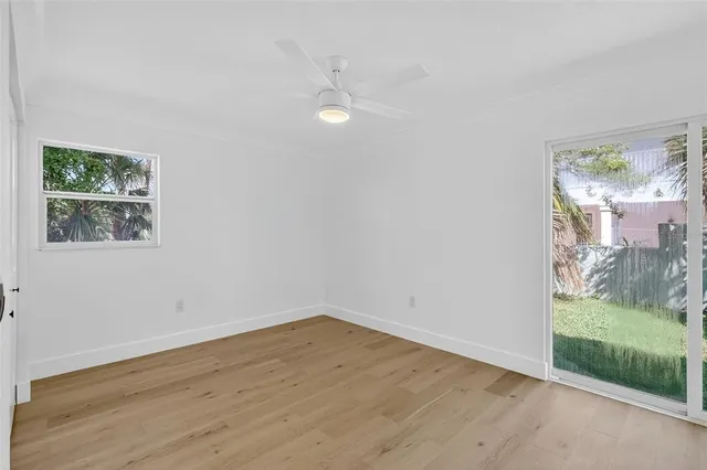 a bathroom with a granite countertop toilet and a sink