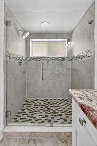 a view of a house with a yard and potted plants