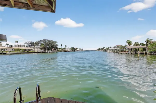 a backyard of a house with outdoor seating
