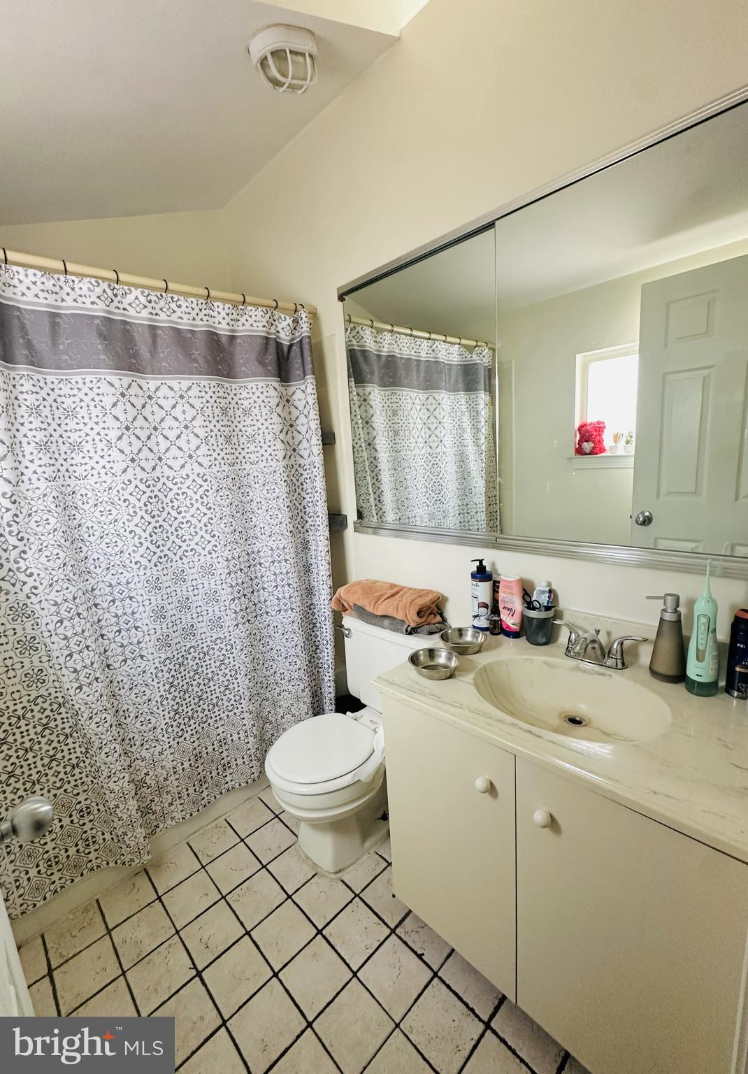 28 North Wolfe Street Baltimore, MD 21231 - Photo 21 of 25 a bathroom with a granite countertop sink mirror vanity and toilet