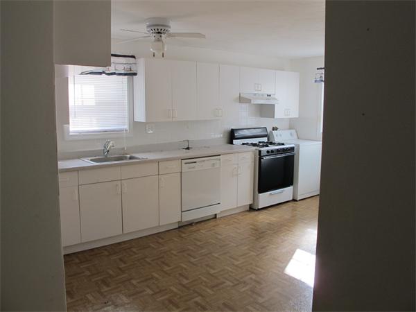 16 Butler Street Wareham, MA 02532 - Photo 4 of 7 a kitchen with a stove and a sink