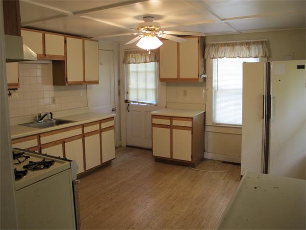 16 Butler Street Wareham, MA 02532 - Photo 5 of 7 a kitchen with a sink appliances and cabinets