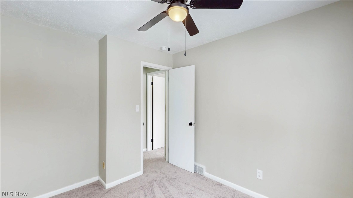 3312 Bancroft Road Akron, OH 44333 - Photo 28 of 50 Spare room with light carpet and a ceiling fan