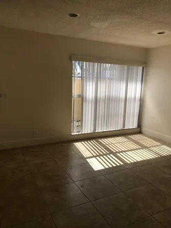 a view of an empty room and window