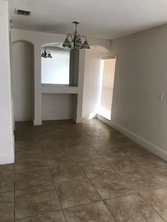 a view of a windows and a chandelier in a room
