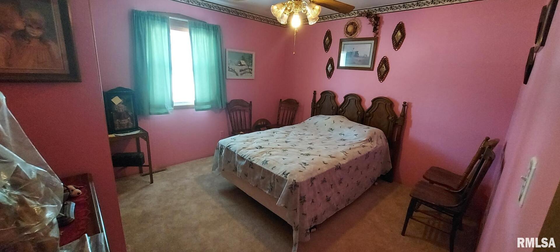 862 270th Street Viola, IL 61486 - Photo 16 of 17 a bedroom with a bed and a chair