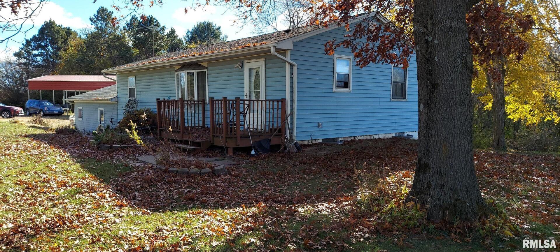 862 270th Street Viola, IL 61486 - Photo 3 of 17 a backyard of a house with table and chairs