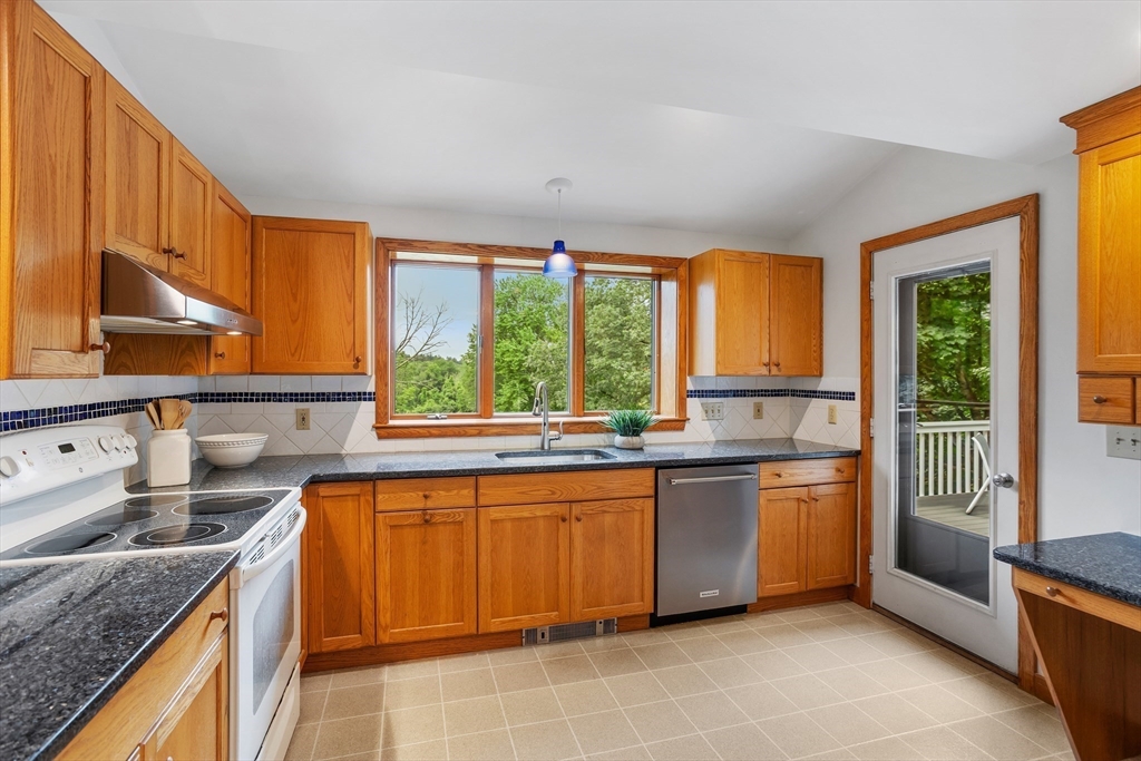 444 Middle Road Boxborough, MA 01719 - Photo 13 of 42 a kitchen with a sink stove and cabinets