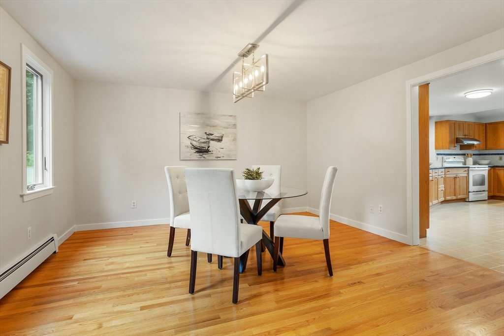 444 Middle Road Boxborough, MA 01719 - Photo 14 of 42 a view of a dining room with furniture and wooden floor