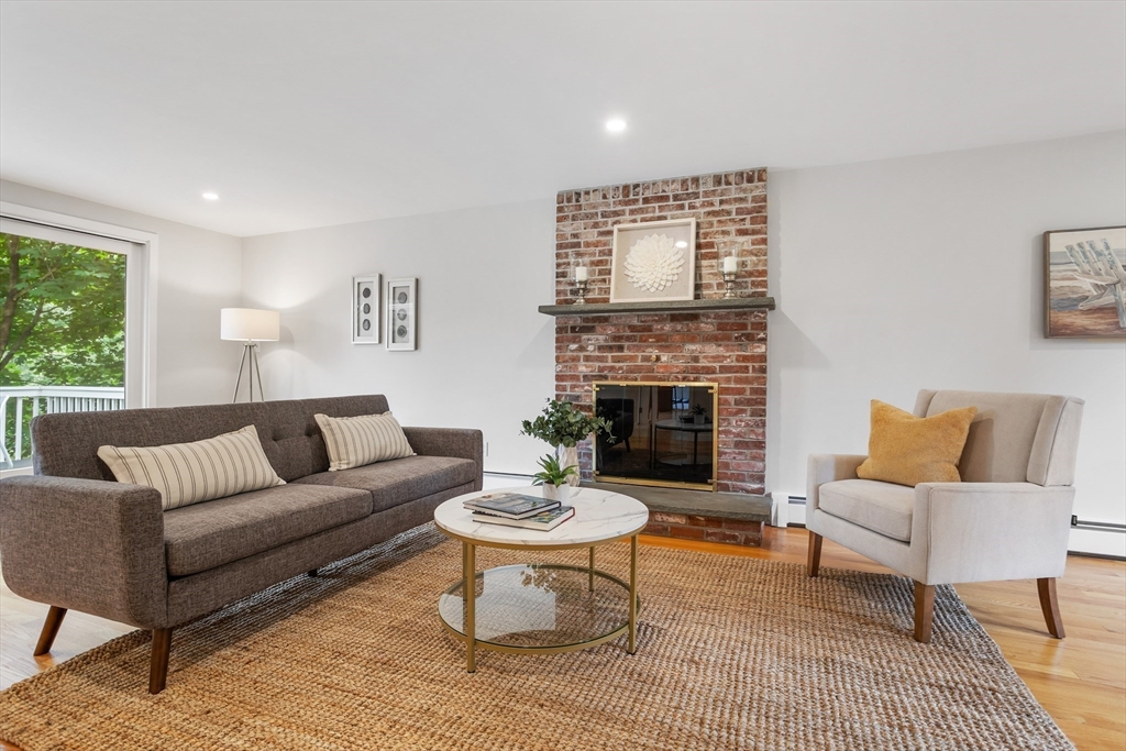 444 Middle Road Boxborough, MA 01719 - Photo 18 of 42 a living room with furniture and a fireplace