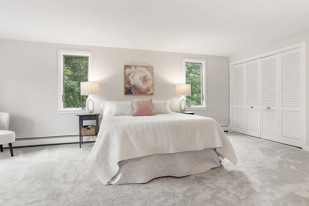 444 Middle Road Boxborough, MA 01719 - Photo 22 of 42 a spacious bedroom with a bed and a window