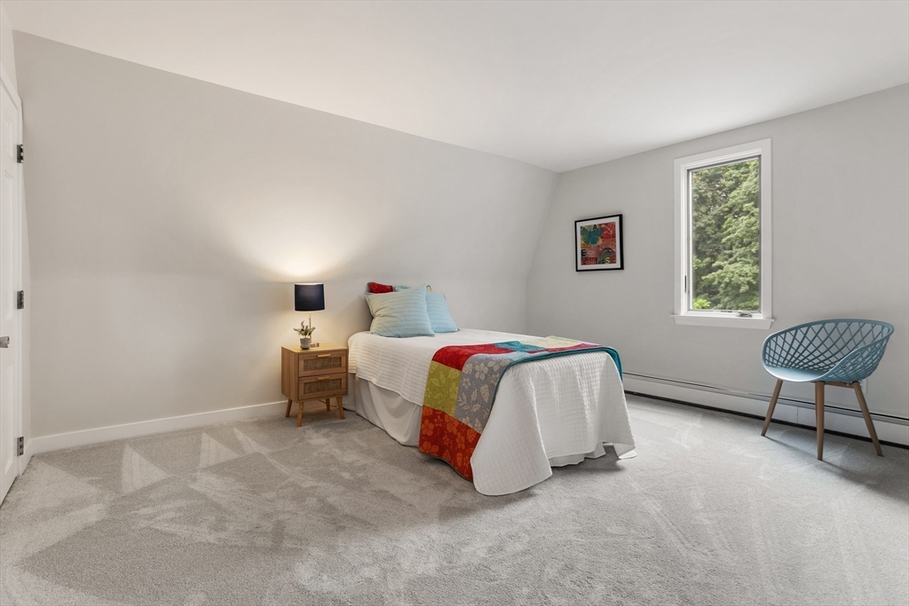 444 Middle Road Boxborough, MA 01719 - Photo 23 of 42 a bedroom with a bed and a chair