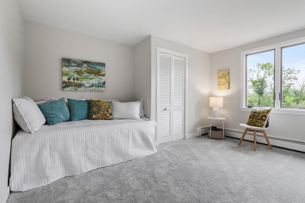 444 Middle Road Boxborough, MA 01719 - Photo 25 of 42 a bedroom with a bed and a couch